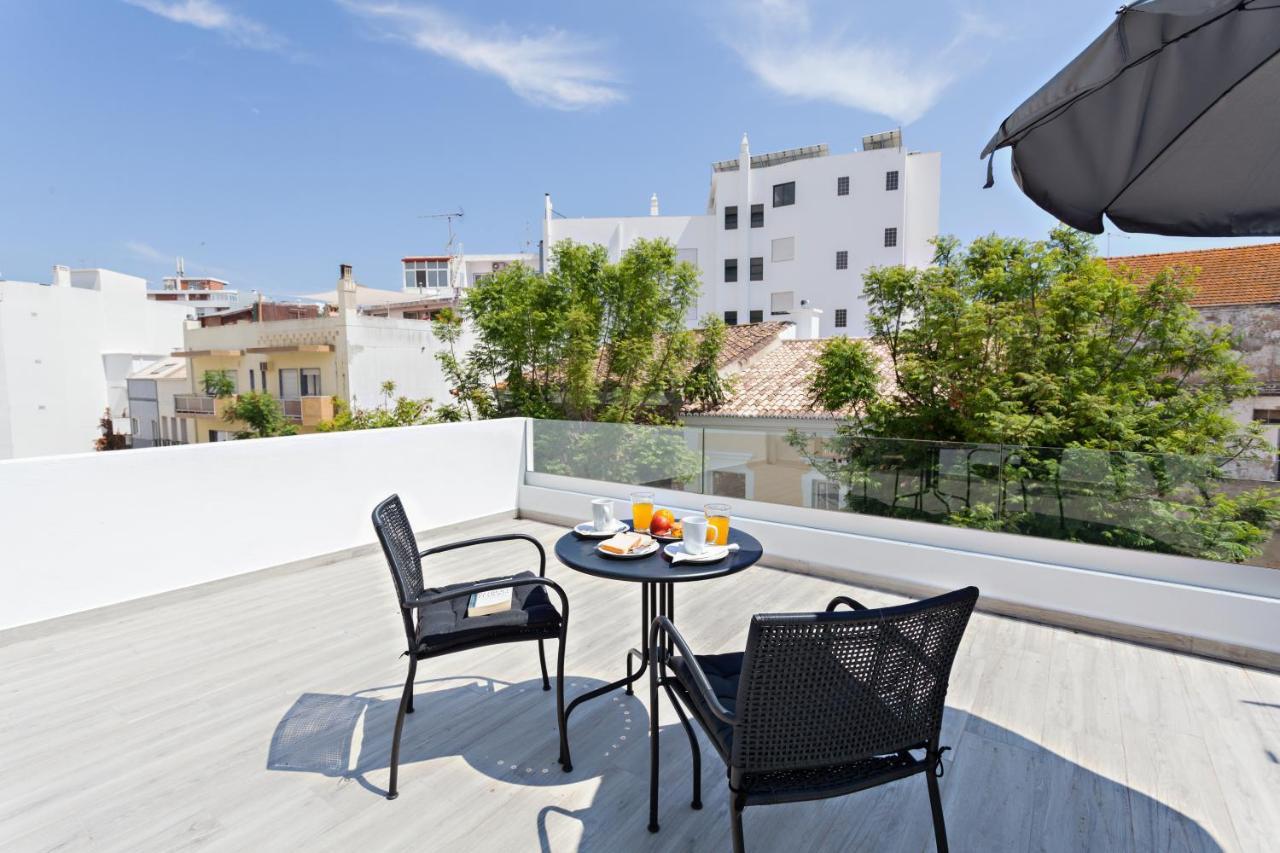 Faro Clara Suites Bagian luar foto