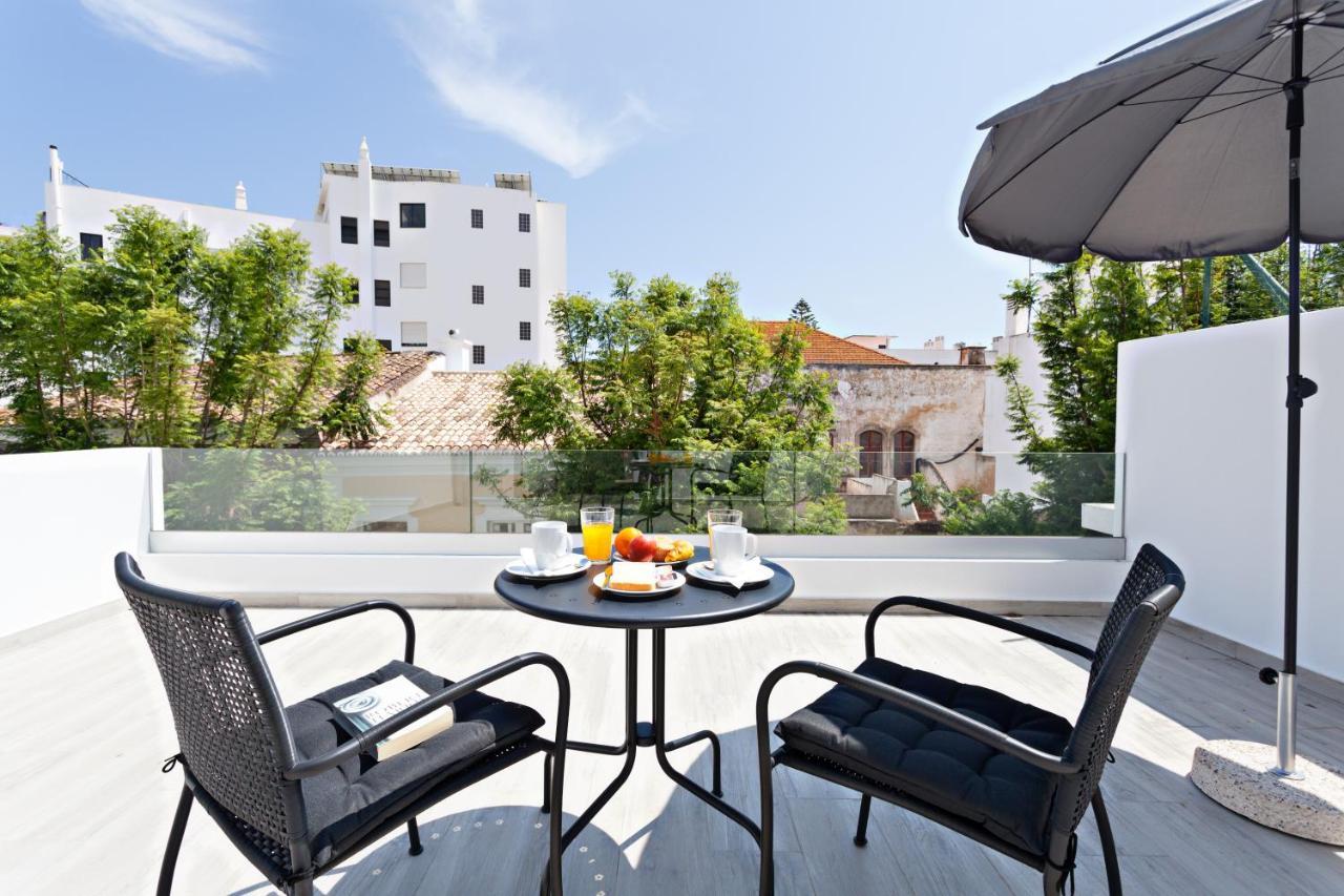 Faro Clara Suites Bagian luar foto
